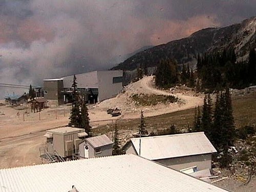 A tower camera shows the forest fire near the ski resort Thursday