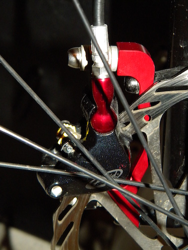 New red anodized NSB brake mount adaptor install on my Stumpy - rear view.
Another excellent Canadian product.