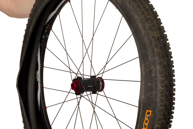 You only need to remove one side of the tire's bead