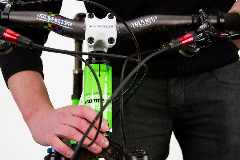 Place your hand over the fork crown and lower headset cup to feel for any slop from a loose headset