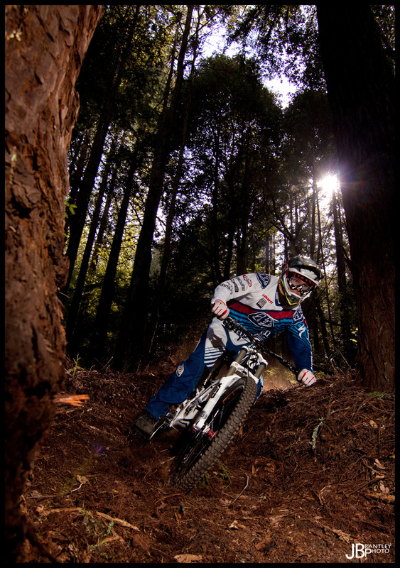 Ripping the trail. Love the sun in this one along with the dust in the background!