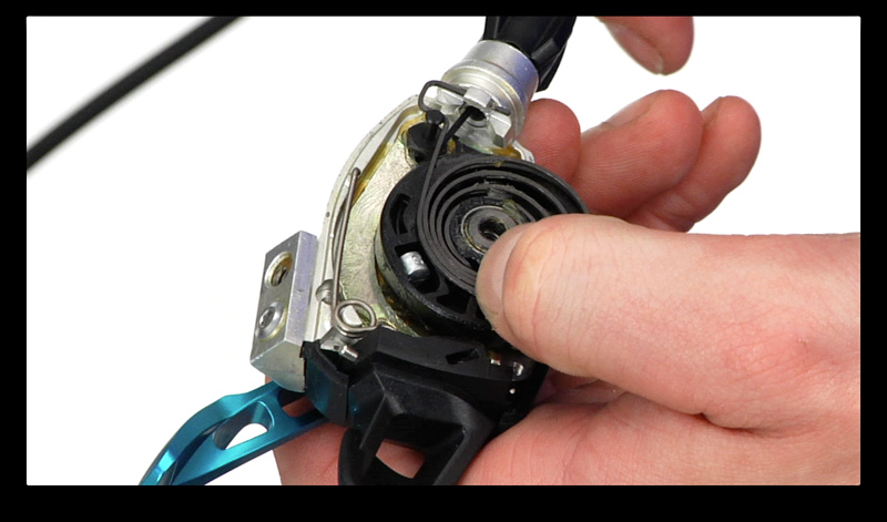 Step 5. You may have to gently pull aside the large spring to allow the cable end to exit the shifter. It only needs a few mm's of extra clearance. You might have to do the same thing when installing the new cable