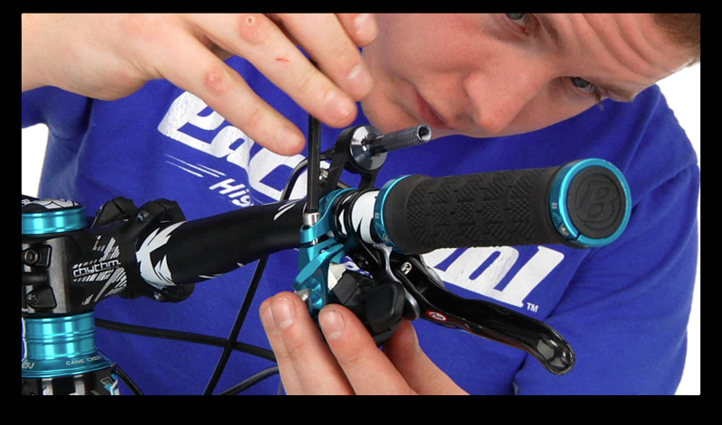 Step 2. Using a 5 mm allen key, remove the SRAM shifter from its perch to allow you to access the silver dial that holds the cover on