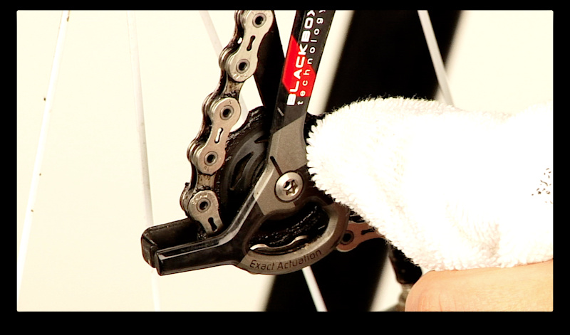 Step 5. Use a clean rag to wipe off any and all chain lube that may be on the outside of the chain, including the side plates and the derailleur's pulley wheels. Extra lube will only attract dirt and create a mess. The only lube that you want on your chain is in the rollers and between the chain plates