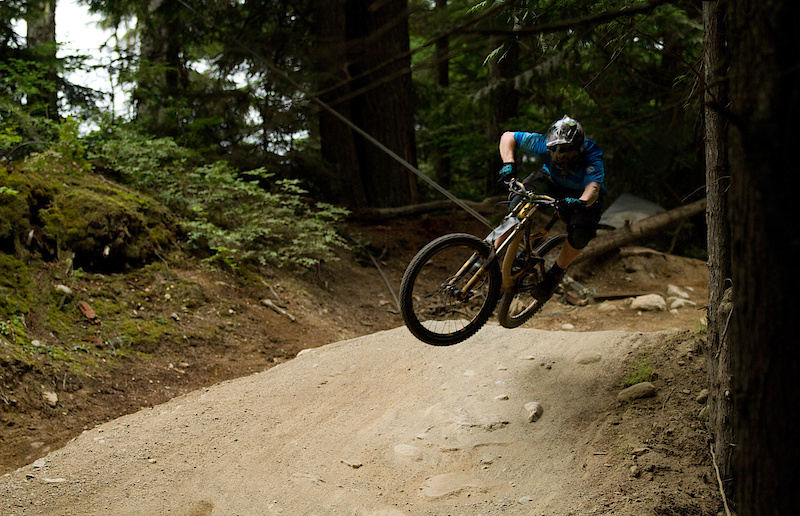 The faster you go on the 2011 Demo, the faster you'll want to go. The new bike has a great temperament - if you want to boost, the bike will do it, but if you want to stay low and fast, it'll do that as well. I had some of my fastest runs down Whistler's machine built trails after only a few hours on the Demo, but the black and yellow bike loved the rooty gnar of the upper mountain as well. Rider: Mike Levy, Trail: Heart of Darkness, Whistler.