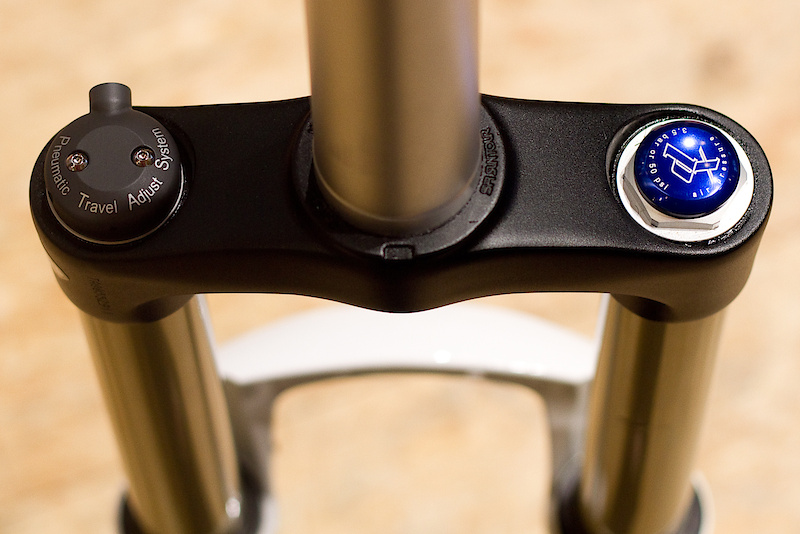 Rider's view of the remote travel adjust Durolux TAD fork that allows for either 120-160 mm or 140-180 mm of range via a sealed air cartridge and bar mounted remote. While there are other long travel adjustable length forks out there, not many of them use a remote to get the job done, this may appeal to some riders. Depending on what features you are looking for, the Durolux line is available in 140, 160, and 180 mm travel options if you are looking for a fork with a set amount of travel. Adjustable travel can be found on the TAD models and goes from 120-160 mm or 140-180 mm.