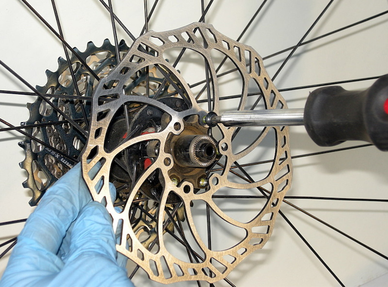 Reassemble the rotor to the hub. Keep your nitrile gloves on for the reassembly process to ensure that you won t be introducing any impurities to the pads or rotor.