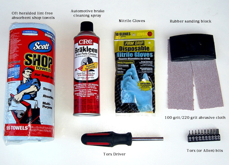 What you need dedicated shop towels are a good idea because aerosol brake cleaner will eat additives and plastics in cloth or parer-type napkins and could cause more trouble. Eye protection is a good idea too when using chemicals. We show you the tools necessary to remove Magura brake pads. You ll need a slightly different kit to remove other types of pads. Finally. we used 100-grit abrasive because it gets the job done quickly. If your rotors use a spider then make a sanding block from a paint stirring stick or similar or carefully work the rotor with the edge of the rubber block.