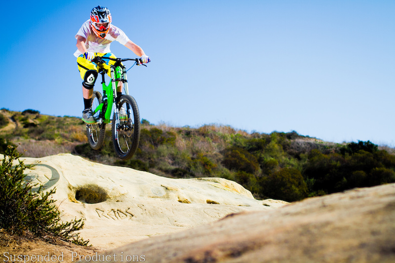 Yes that is Dan Danyul The Photographer and yes he is riding a Downhill bike