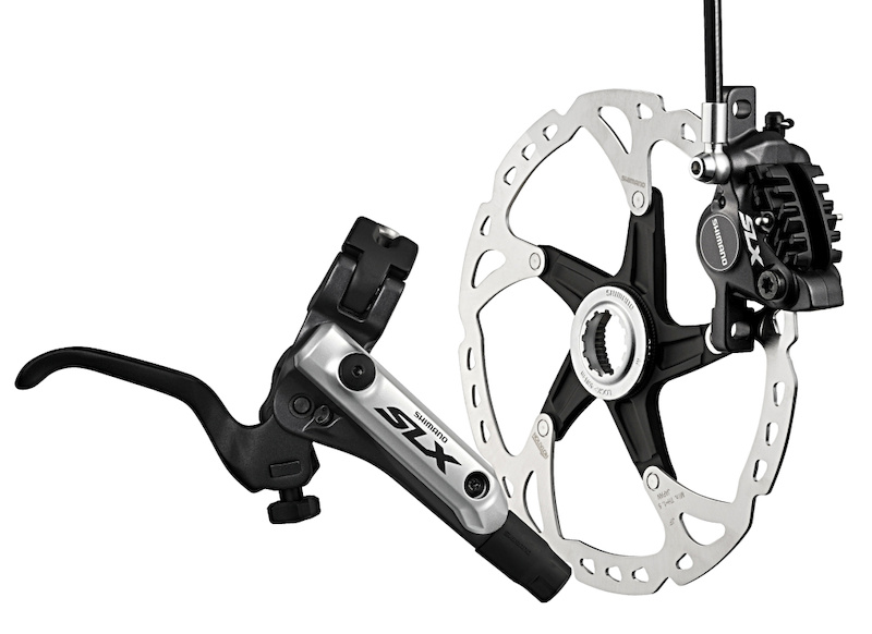 SLX brakes are big news. Ice Tech XTR and XT has gained traction among the best rider in the sport as the best of the best. SLX shares the ceramic pistons finned pads and aluminum-sandwich rotors below and the crisp-feeling Servo Wave action shorty brake lever design above.