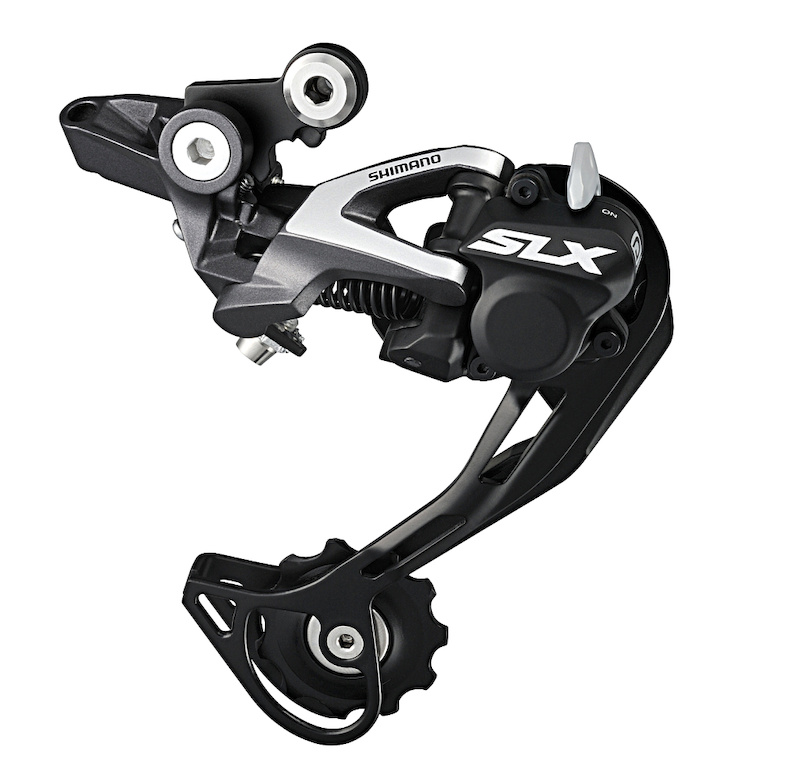 SLX rear derailleurs get the Shadow Plus friction clutch that was only released to XTR a year earlier. Insiders say that the clutch design is the second-gen version. A Non-Plus rear mech is also available. Both feature Shimano s new Direct Mount hanger that replaces the short pivot arm above the derailleur body and frame s derailleur hanger with a single sturdy link.