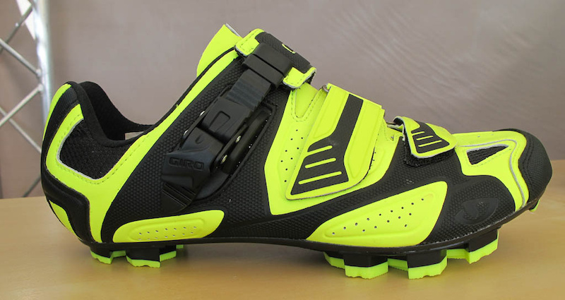 The Giro Code shoe caught my eye because of its High Vis colors once I asked more about the shoes I learned that it s Giro s high end XC shoe featuring an EC90 carbon shank three strap closure toe spikes and rubber soles and retails for 290 USD