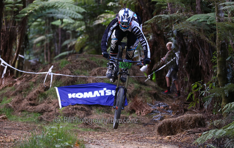 090213 Loic Bruni narrowly avoids going over the front. Bike NZ Mountain Bike Cup Series Downhill Hunua Ranges. . Photo Simon Watts bwp.co.nz bikeNZ