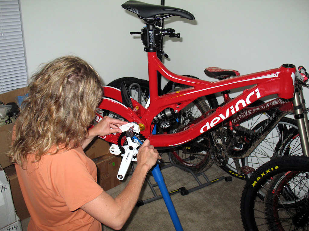 My wife pulling apart the new bike for the 2012 season in prep for some sponsor parts. Women who ride are awesome, those that build their own stuff, even better.