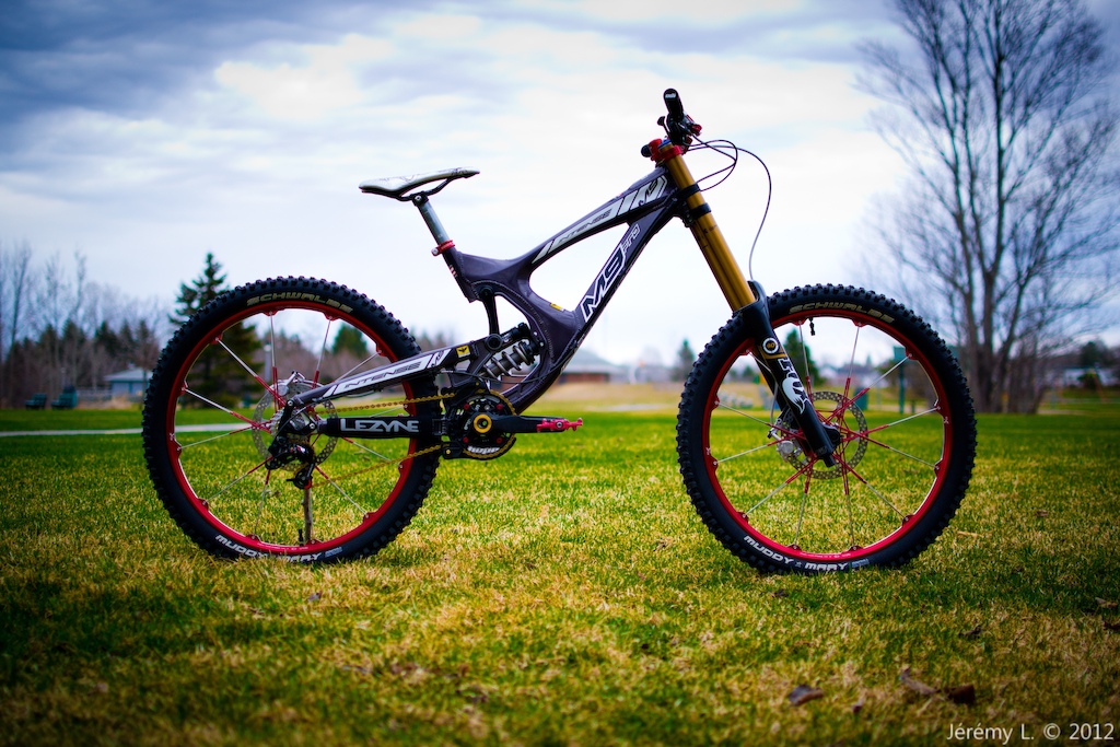 Intense m9 FRO_ FOX DHX rc4 with ti spring, k9 spring bearing, RWC needle eyelet_ FOX 40 Kashima 2012_ HOPE top crown_ E.13 LG1+ crank and chainguide_ HOPE 36t chainring_ KMC X10SL chain_ Darkcycles arachnid pedals_ Crankbrothers Opium 3 wheelset_ Schwalbe muddy marys (tubeless)_ SRAM X-0 DH derailleur_ X-0 trigger_ SRAM 1070 11-23t cassette_ Jagwire carbon liner_ HOPE V2 EVO brakes with red levers and caps_ HOPE V2 red vented rotors_ HOPE red seat clamp_ Crankbrothers cobalt 3 seatpost_ Selle Italia TLD SLR saddle_ Crankbrothers Opium 3 handlebar_ ODI rogue lock grips