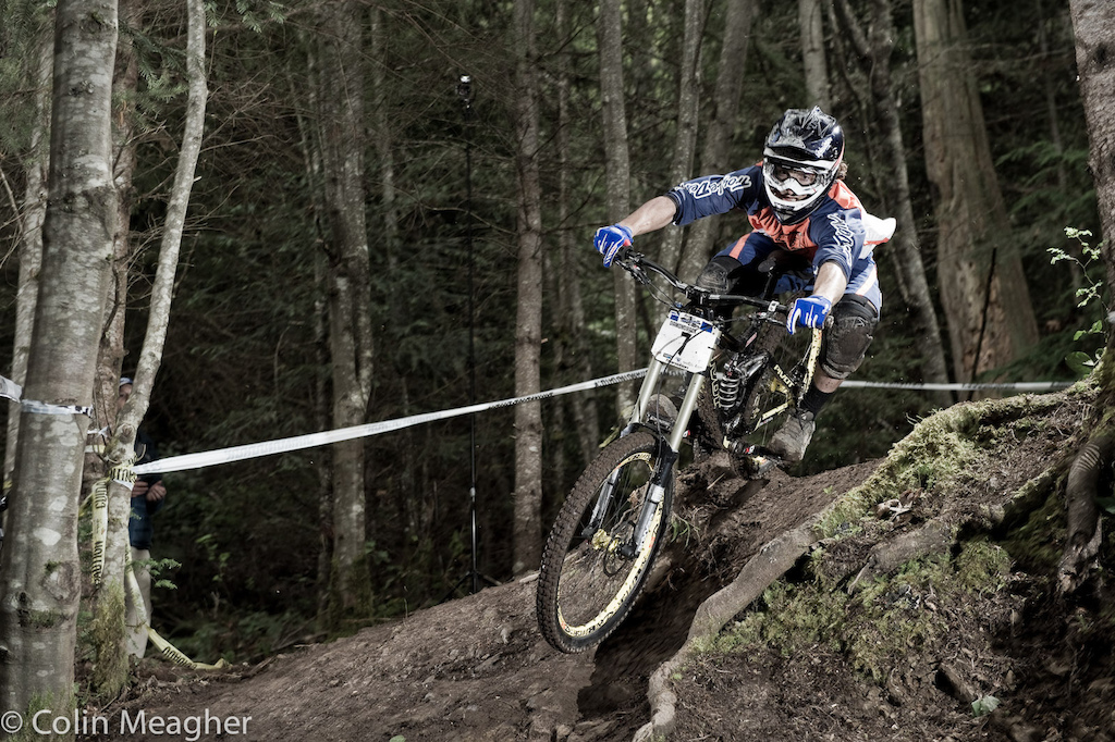 Luke Strobel railing into one of the final corners of the track aboard his Pivot Phoenix.