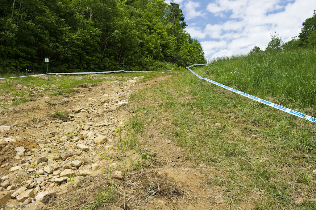 The fadeaway right rolled immediately into this fade-away right. Erosion s taken such a toll here that now the riders will be hugging the tape as inside as they can in order to gain entry onto a freshly built flat turn that leads into the hip under the chair. This line looks smooth but it s tight and as riders cut the inside look for rocks to start creeping to the surface.