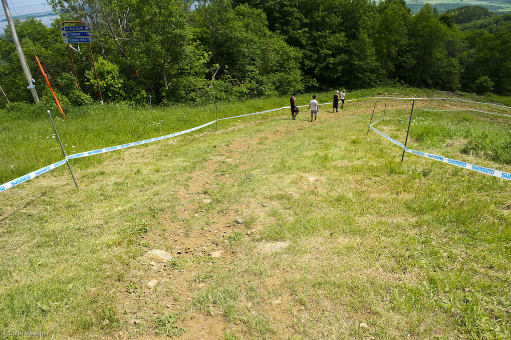 More motorway and then into the axe heads of death right hand sweeper 30 seconds or so above the hip section under the gondola. It looks tame at this point but more tires were blown here than almost anywhere else on the track in previous years.