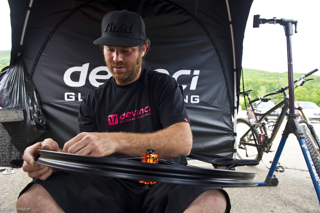 It doesn t matter how tough your wheels are here at Mt St Anne this bitch will break them. Len of Devinci lacing up a fresh rim for Nick Beer to destroy.