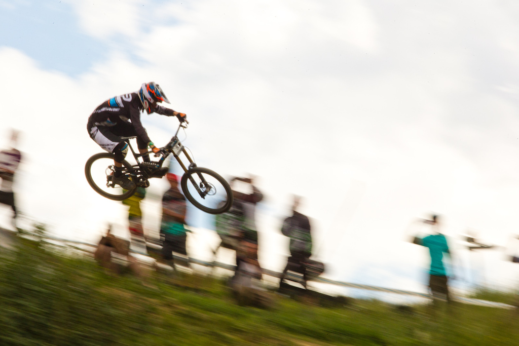 Sam Blenkinsop here is flying on one of the huge features of this Giant Air Downhill