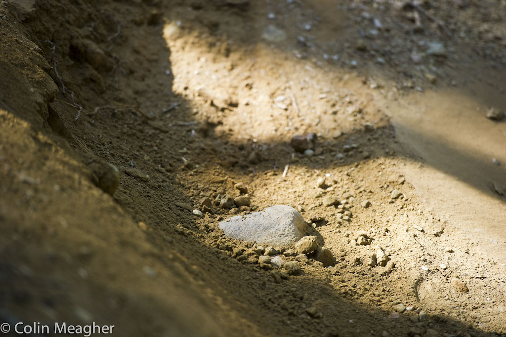 All during the final practice on the DH track this morning this stone crept out--right in the middle of a must hit berm. I just know this bastard gave someone a bad race...