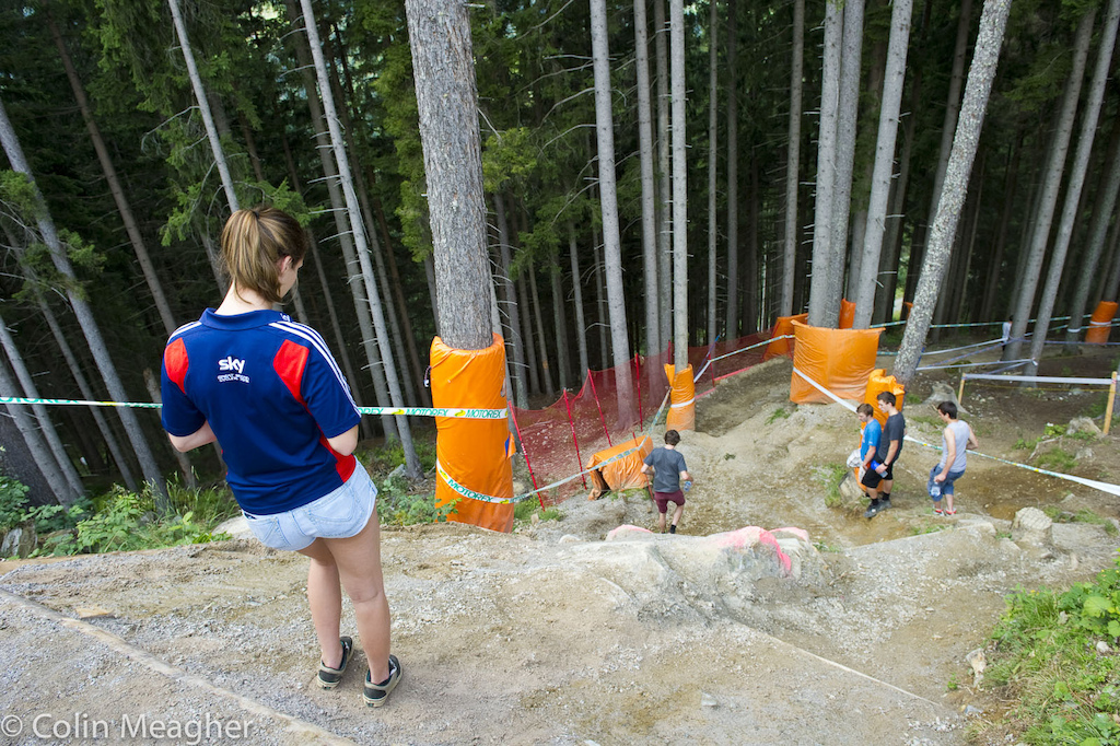 Manon Carpenter heading down the steep rollover into the first woods. Yeah it is as steep as it looks but it s pretty straightforward.
