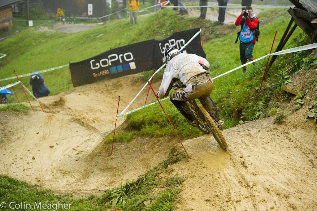 Sam Dale diving into a wild ride on the rollercoaster of berms up top.