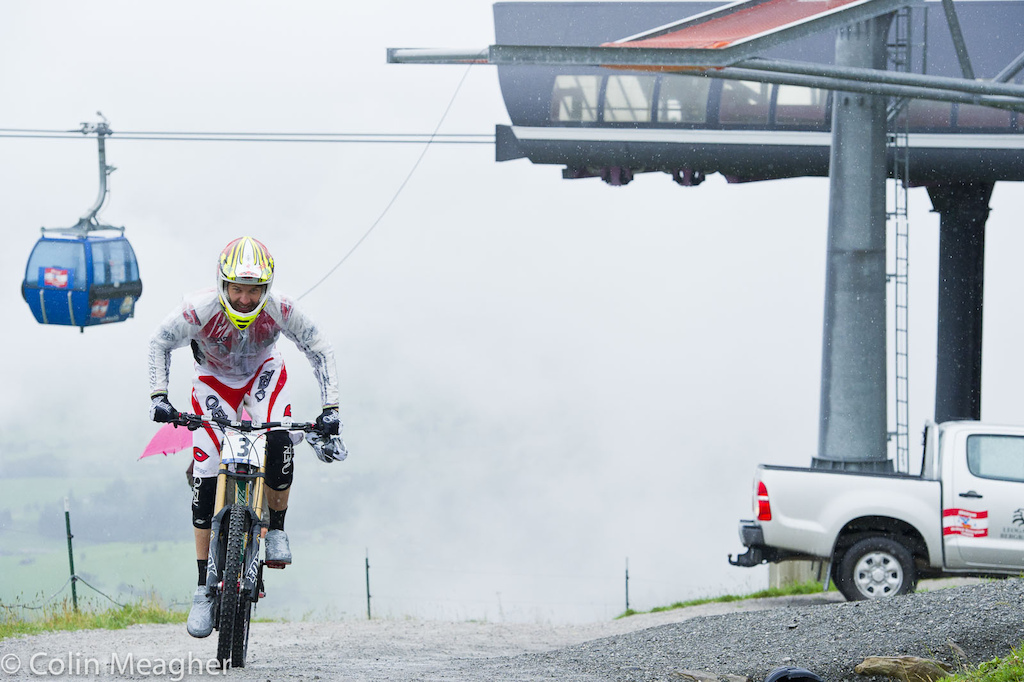 Grin and bear it--Greg Minnaar pedaling to the start in a kit guaranteed to be a filthy wreck in short order.