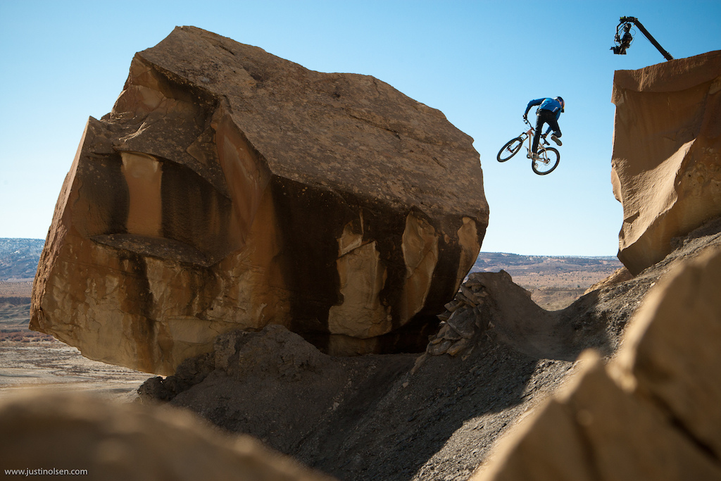 Minutes after bagging the interview clips Paul Bass bags a tailwhip on this step up to rock ride to gap drop... The eye in the sky captures it all.