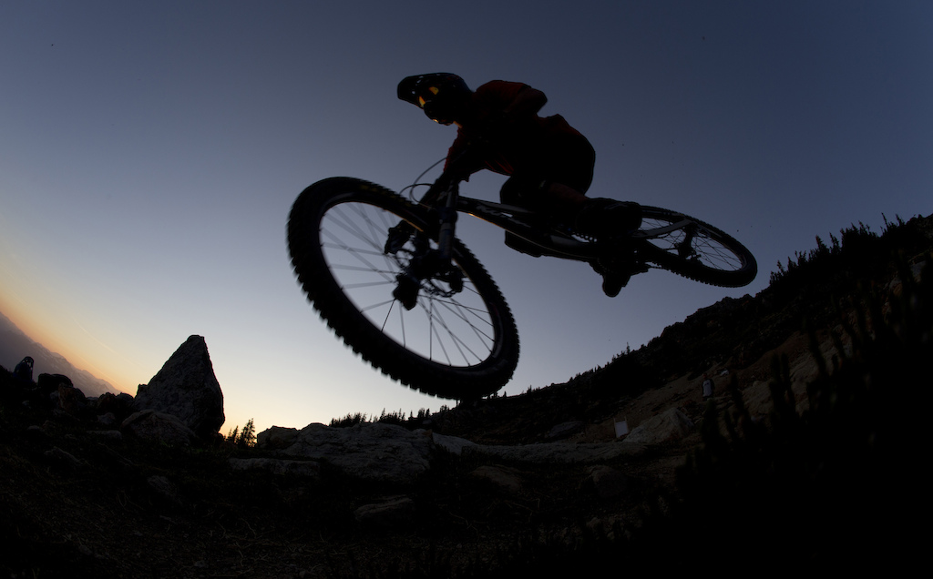 Mountain bike rider Dylan Sherrard flies through the air on the top of the world bike trail at the peak of Whistler mountain in Whistler B.C. Saturday August 11 2012. THE CANADIAN PRESS Jonathan Hayward