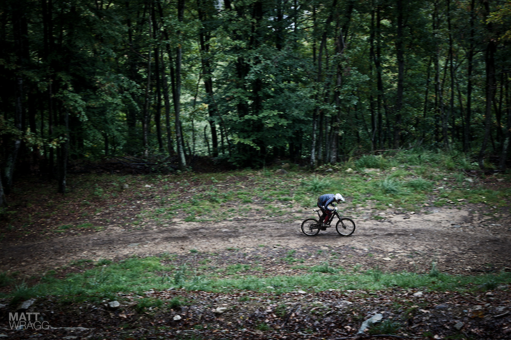 Lugging the DH bike over one of the flat pedals.