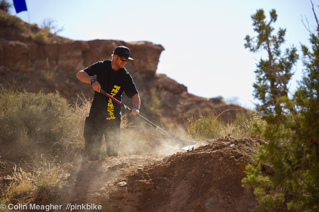 Dry and dusty. But it is after all a desert. Mike Hopkins packing on a bit more. Only to have the wind take about half of every shovel load away. Yes the wind. It was out in full force all afternoon. Sending anything major was out of the equation as riders opted to play it safe and place a few final loads of dirt on their lines.