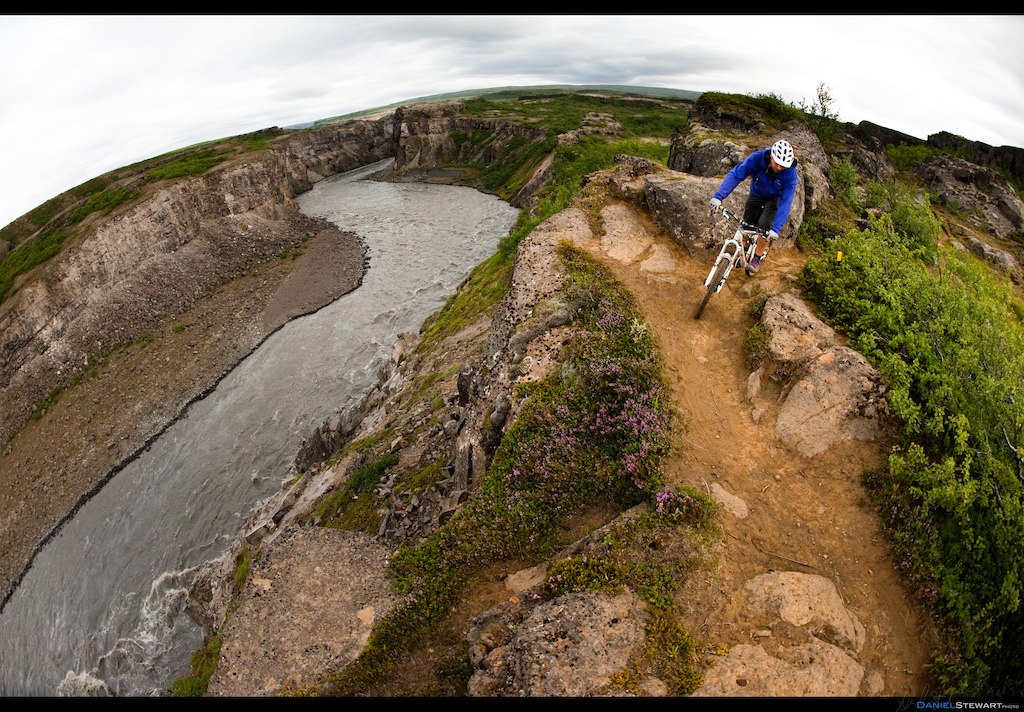Bryce Borlick riding along the canyon rim of the J kuls Fj llum River