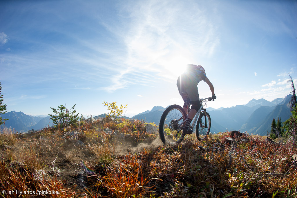 Lindsey Voreis rides her bike in the Alpine above Retallack Lodge near Kaslo BC