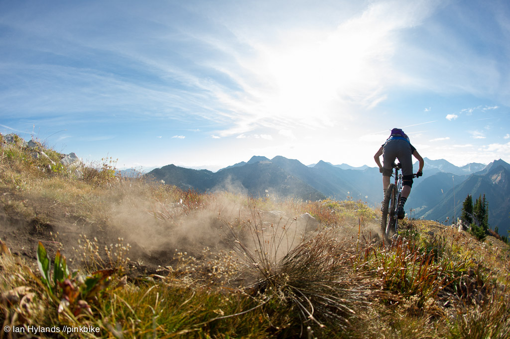 Lindsey Voreis rides her bike in the Alpine above Retallack Lodge near Kaslo BC