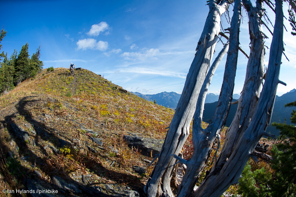 Lindsey Voreis rides her bike in the Alpine above Retallack Lodge near Kaslo BC