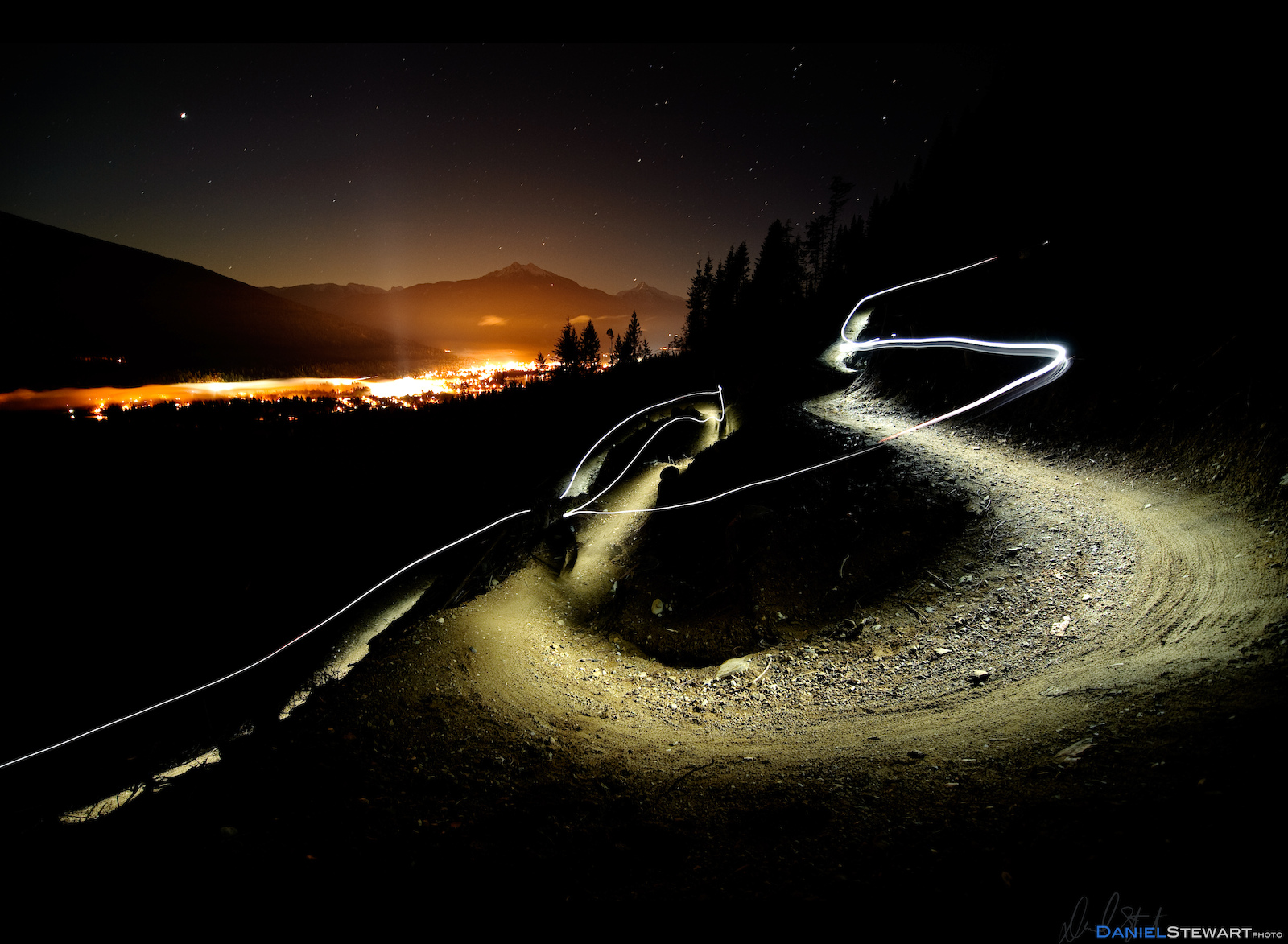 Stuart Dickson riding a new trail built in a cut-block at night on Boulder Mountain, Revelstoke, BC.